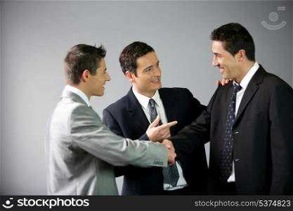 Three businessmen laughing