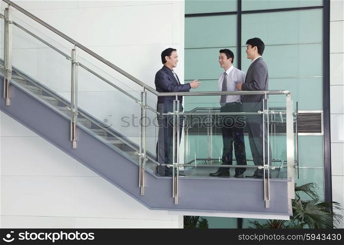 Three Businessmen on Stairway