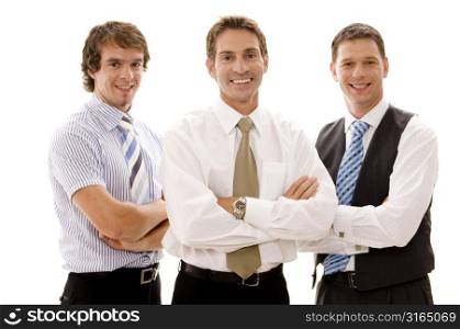 Three businessmen standing with their arms crossed and smiling