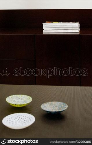 Three ceramic bowls on a table