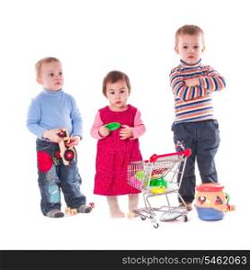 Three children play with toys isolated on white