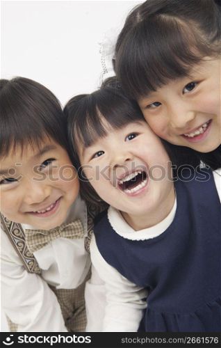 three children smiling