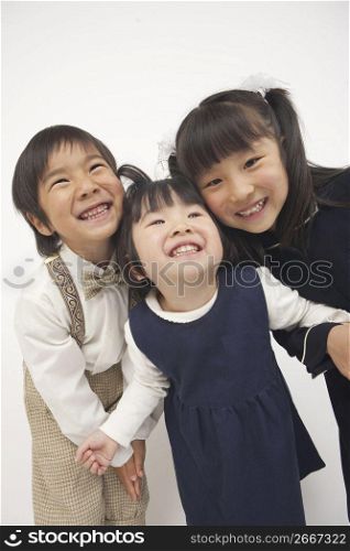 three children smiling