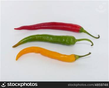 Three chili peppers on white the background. Three chili peppers on white the background.