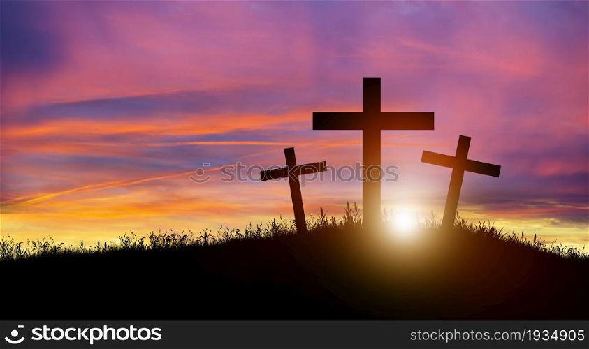 Three Christian cross on hill at sunset. Crucifixion of Jesus Christ. Christmas, Easter, Salvation of sins, Sacrifice, and Religion Concept.