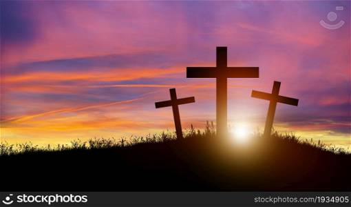 Three Christian cross on hill at sunset. Crucifixion of Jesus Christ. Christmas, Easter, Salvation of sins, Sacrifice, and Religion Concept.