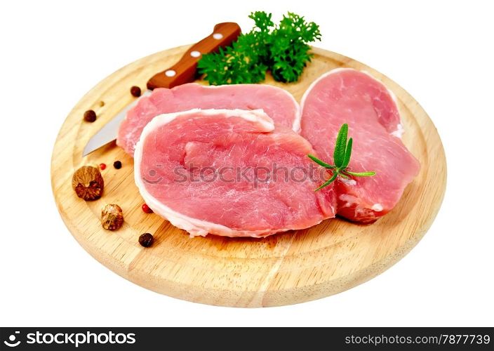 Three chunk of pork, nutmeg, parsley, rosemary, pepper, knife on a round wooden board isolated on white background