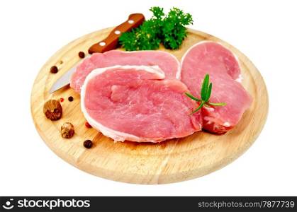 Three chunk of pork, nutmeg, parsley, rosemary, pepper, knife on a round wooden board isolated on white background
