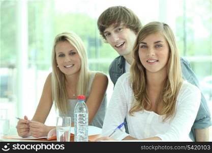 Three classmates revising together