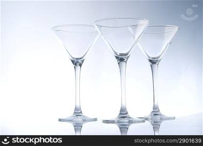 three coctail glasses on light background
