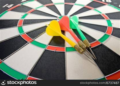three color darts on the dart board