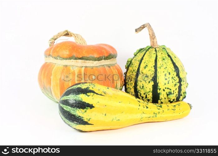 Three colorful decorative gourds, isolated