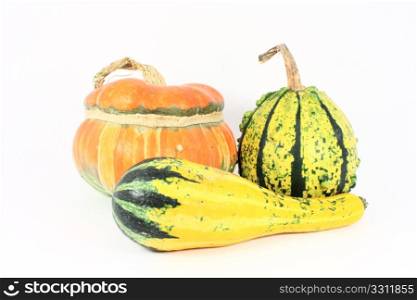 Three colorful decorative gourds, isolated