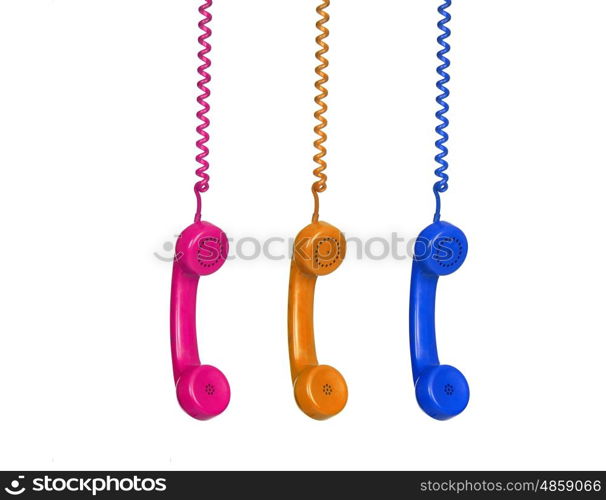 Three colorful phones hanging from a cable isolated on a white background