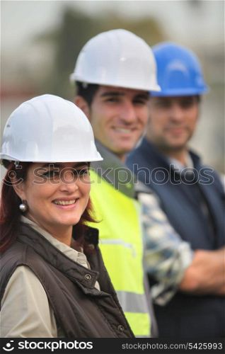 Three construction colleagues on-site