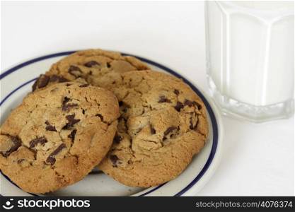 Three cookies and a glass of milk