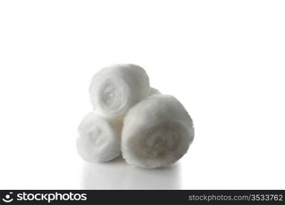 three cotton balls on white background