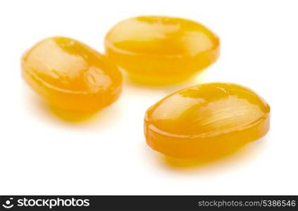Three cough drops isolated on white
