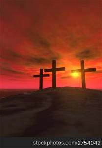 Three crosses on a hill on a background of a sunset