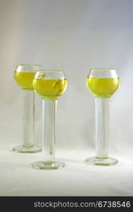 Three crystal liqueur glasses, isolated on plain background, Seattle