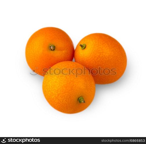 Three delicious kumquat, carved on a white background