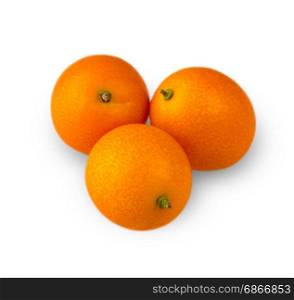 Three delicious kumquat, carved on a white background