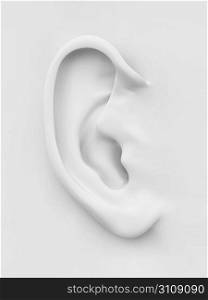 Three-dimensional white soft human ear on white background. 3d