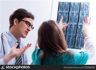 Three doctors discussing scan results of x-ray image. The three doctors discussing scan results of x-ray image