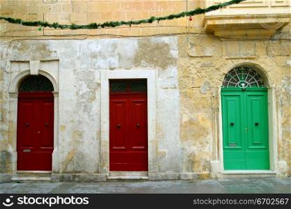 Three doorways in Maltese houses, Malta.
