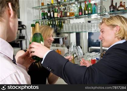 three drunken persons drinking and talking at a bar