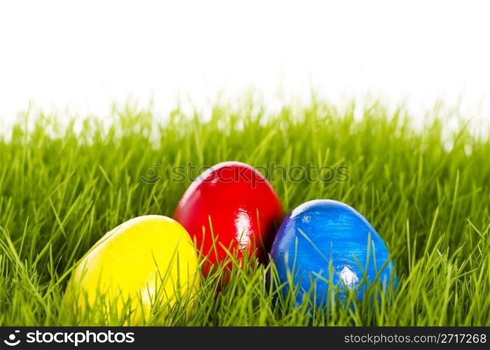 three easter eggs with soft focus in grass. three easter eggs with soft focus in grass on white background