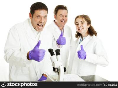 Three enthusiastic scientists (or doctors) giving a big thumbsup, happy they have had a breakthrough. Isolated.