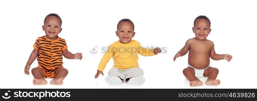 Three equal african babies with differents clothes isolated on white background