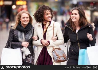 Three Female Friends Shopping Outdoors Together