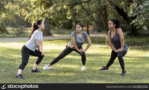 three female friends training park