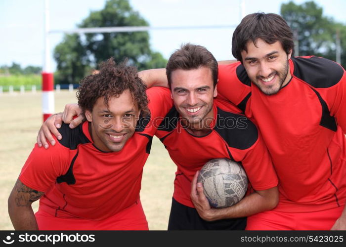 Three football team mates