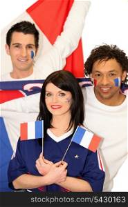 Three French people supporting their national team