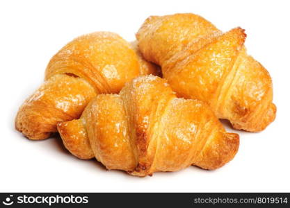 Three fresh just baked croissants on white background, isolated