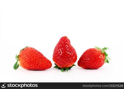 Three fresh ripe strawberries isolated on white background