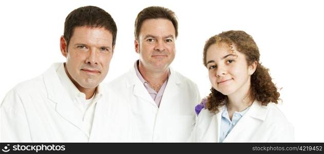 Three friendly scientists or doctors. Wide banner isolated on white.