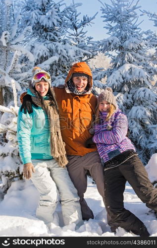 Three friends enjoy snow winter holiday mountains sunny countryside