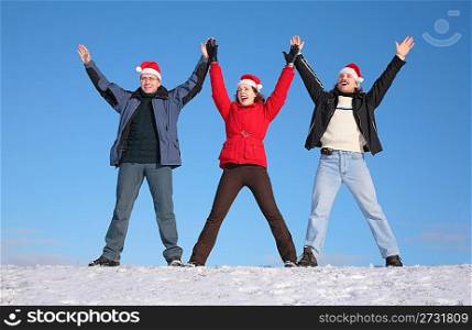 three friends greetings on snow in santa claus hats