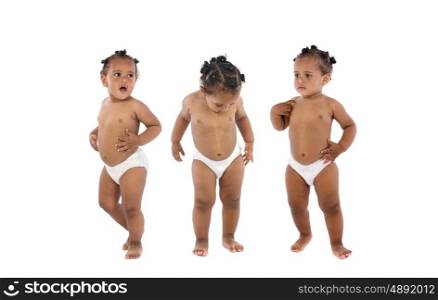 Three funny baby with afro hairstyle wearing diaper isolated on a white background