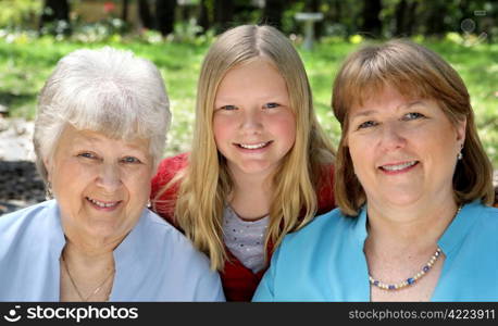 Three generation that look very much a like - a daughter, a mother, and a grandmother.