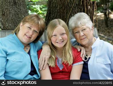 Three generations - a little girl, her mother, and her grandmother. All with blond hair and blue eyes.