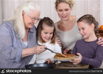 Three generations enjoying crepes