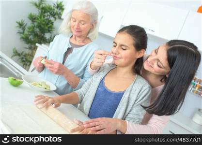 three generations of women baking together