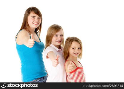 Three Girls Giving Thumbs Up Gesture In Studio