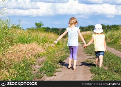 three girls walking at the outdoors