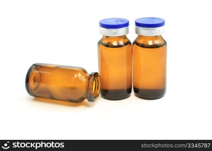 three glass bottles with drug on white background